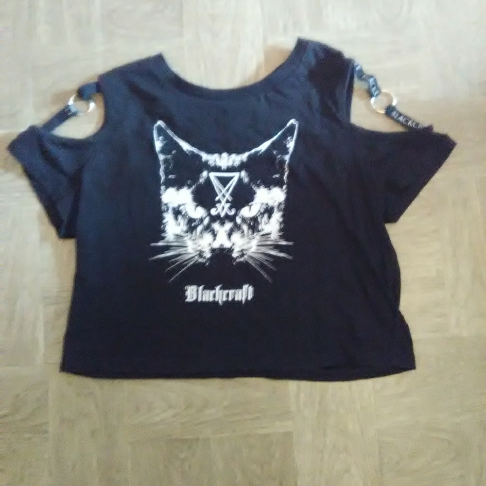 Blackcraft crop top with open shoulder.